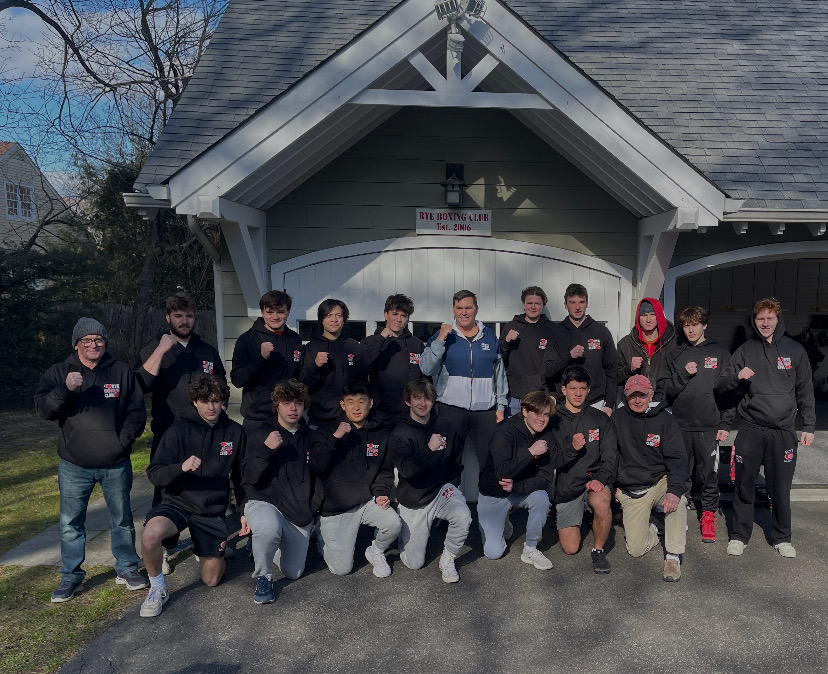 (PHOTO: US Marine Corps veteran and Park Avenue resident Terry McCartney with the Rye Boxing Club, High School boys group in 2022.)