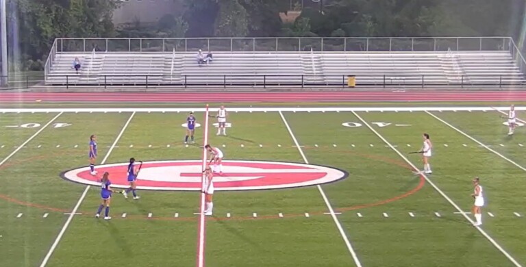 (PHOTO: Rye Field Hockey lines up across from Henry Hudson on a rainy Saturday evening. The Garnets scored seven times in a shutout victory.)