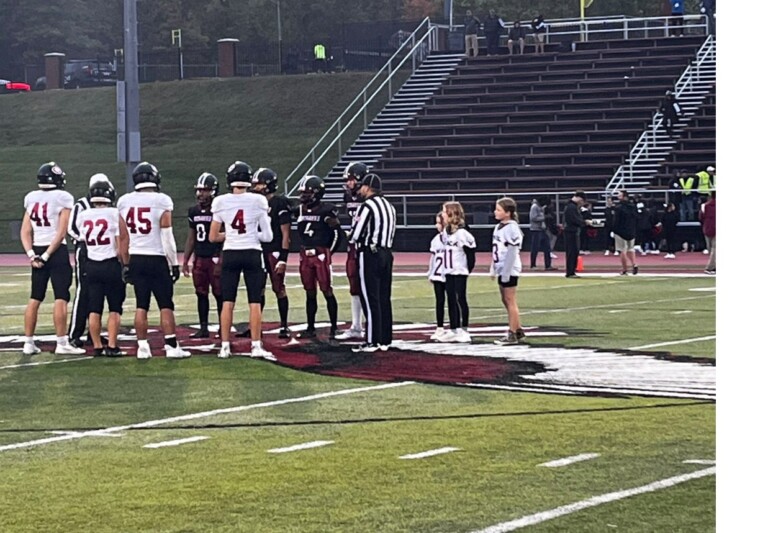 (PHOTO: Rye and Nyack gather for the coin toss ahead of their Week 3 matchup.)