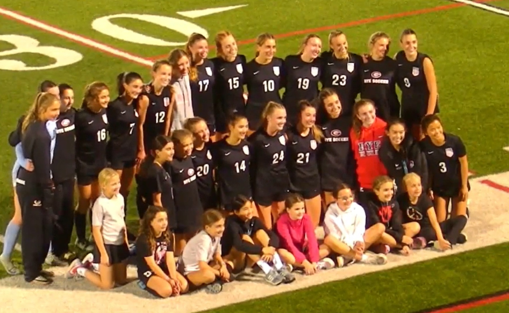 (PHOTO: The Rye Girls Soccer Team posed together with young fans after their thrilling 2-1 extra-time win vs Pearl River.)