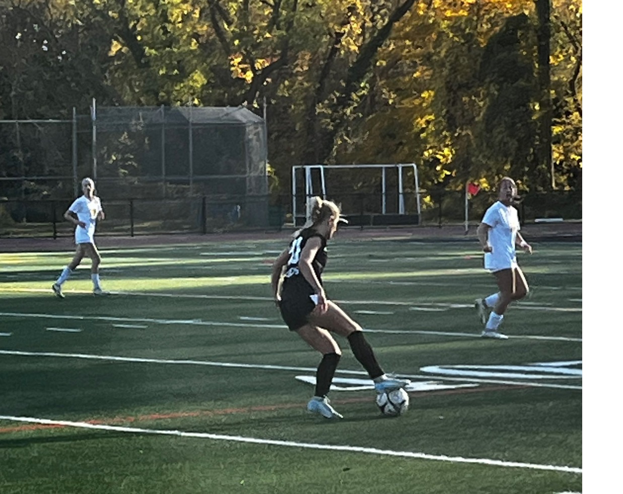 (PHOTO: Rye controls the ball vs Pelham on Monday, October 28. The Garnets won 1-0 to advance to the third round of the Sectional Tournament. Credit: Rye Athletics)