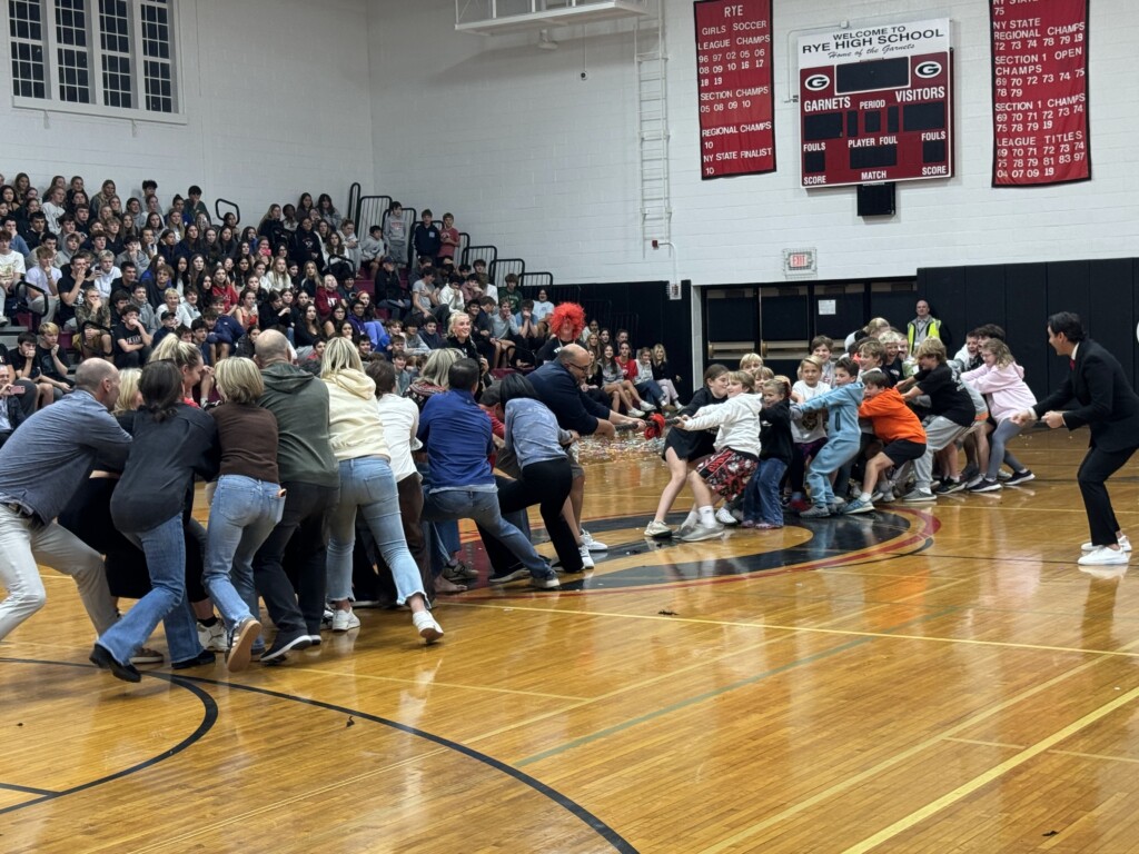 (PHOTO: An adult vs. student tug of war at the annual pre-Rye - Harrison Varsity football game pep rally and bonfire on Thursday, October 24, 2024.)