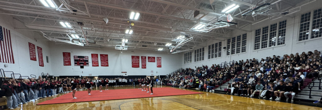 (PHOTO: The Cheer Team at the annual pre-Rye - Harrison Varsity football game pep rally and bonfire on Thursday, October 24, 2024.)