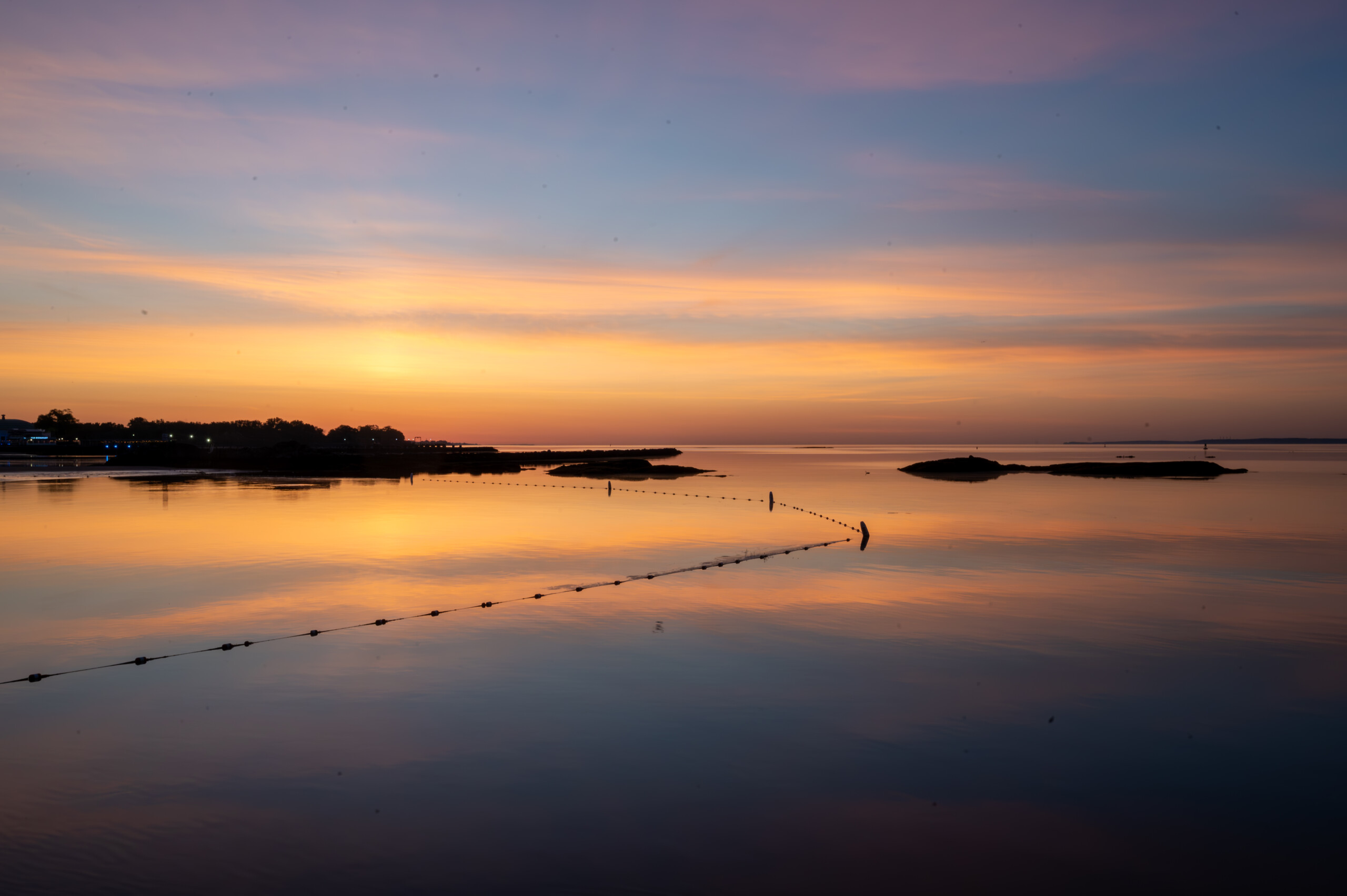 (PHOTO: Sunrise at Oakland Beach. Part of Rye Town Park, it stretches 1,200 feet along the Long Island Sound and offers stunning dawn light displays. By Stacey Massey, author of Fall in Love with Rye.)