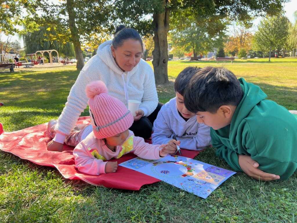 (PHOTO: 5 Steps to Five participants trying and rating new food as a part of nutrition programming at the pavilion at Lyon Park in Port Chester in the Fall of 2024. Contributed.)