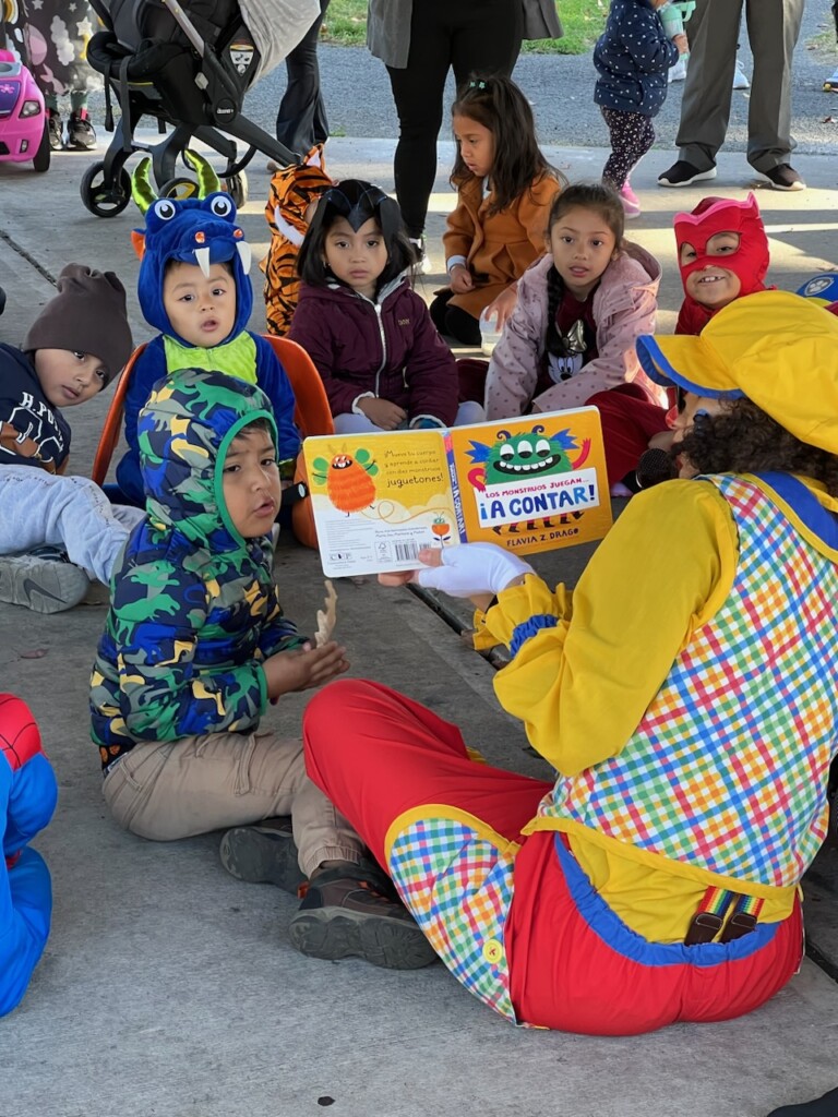 (PHOTO: 5 Steps to Five consultant Meli Almonte as Jubilee the Clown entertaining families at the group's Halloween celebration at the pavilion at Lyon Park in Port Chester, Fall 2024. Contributed.)