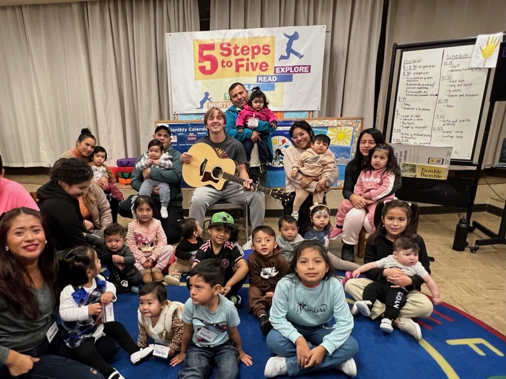 (PHOTO: 5 Steps to Five student volunteer and musician, Colin Lauri, at an event to perform and talk about his research on the importance of music education and the brain. At All Souls Community Center in Port Chester, November 2024. Contributed.)