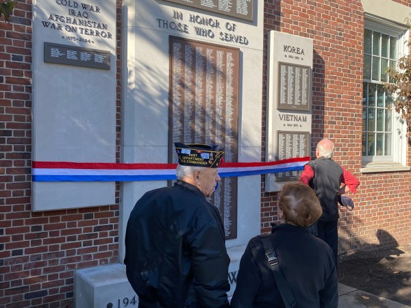 (PHOTO: Taking a moment at the new memorial plaques on Veterans Day November 11, 2024.)