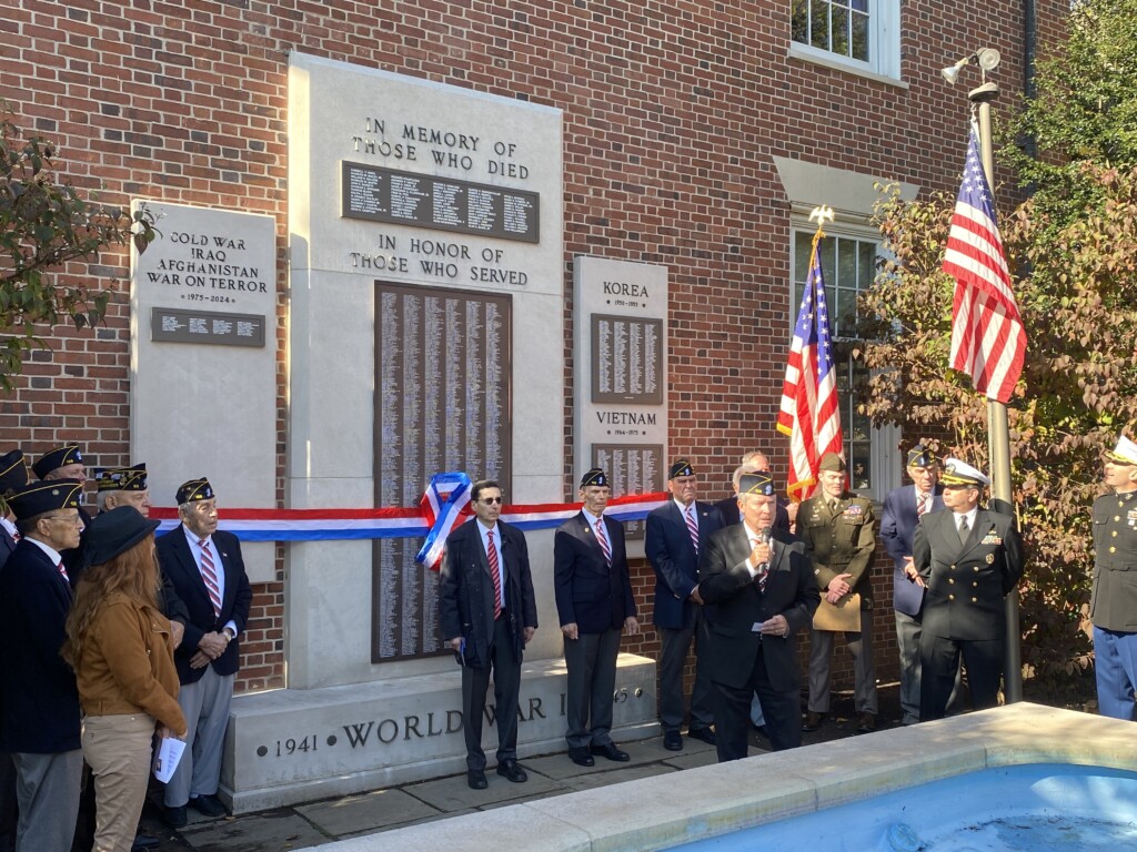 (PHOTO: American Legion Post 128 Finance Officer and Adjutant Tim Moynihan made remarks at the unveiling of the new memorial plaques on Veterans Day November 11, 2024.)