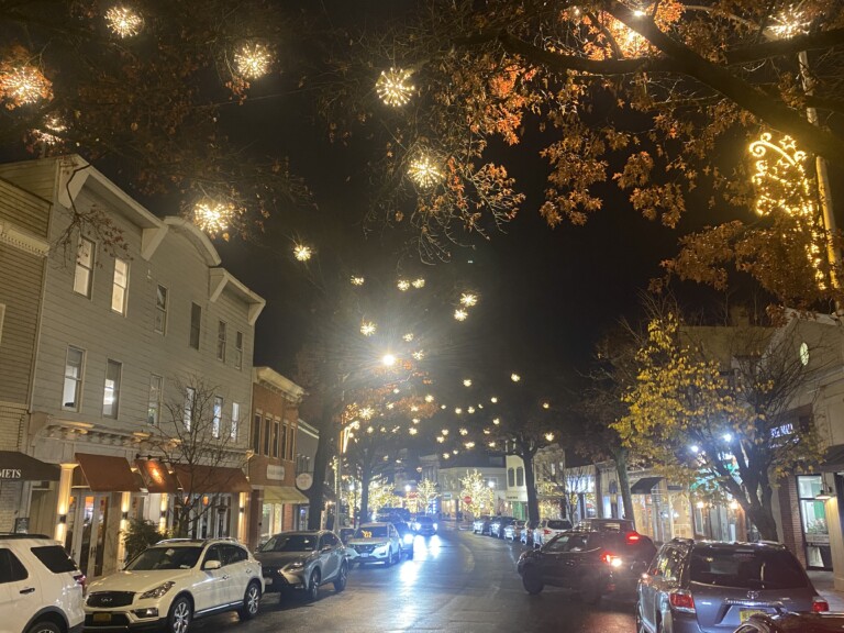 (PHOTO: New winter lights debuted on downtown Purchase Street this week and are expected to remain until early February 2025. Donations from nearly 200 individuals and businesses funding the installation.)