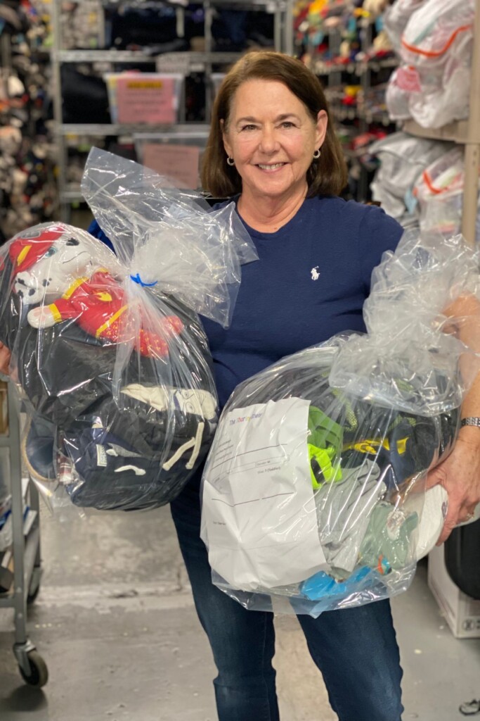 (PHOTO: The Sharing Shelf volunteer Mary Davidson packing orders. Contributed.)