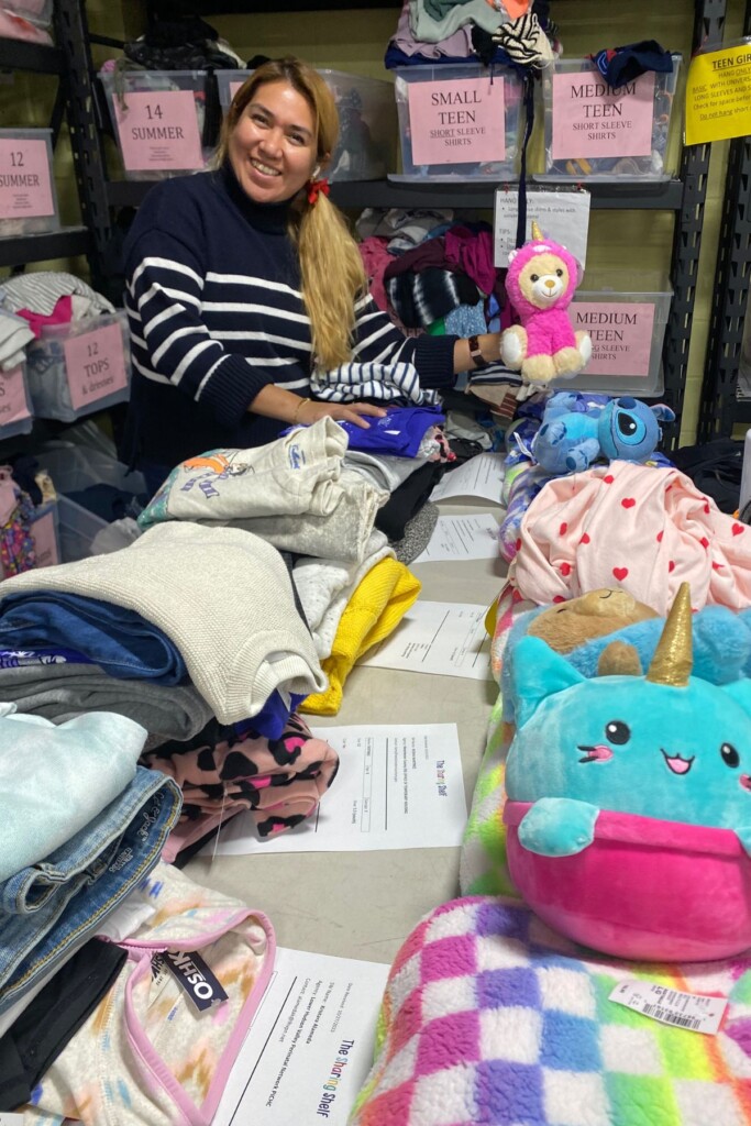 (PHOTO: The Sharing Shelf staff member Ana Guarneros packing orders. Contributed.)