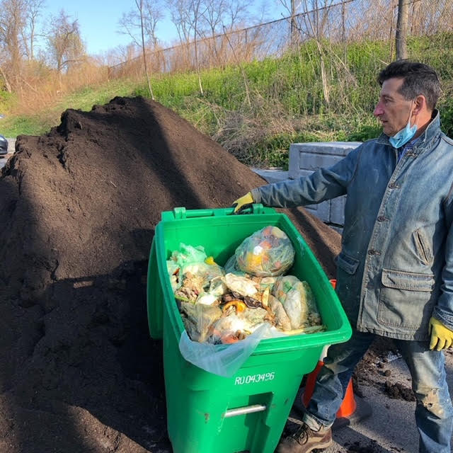 (PHOTO: Just rotten. Rye Sustainability Committee member Chris Cohan at Compost Giveback Day when free compost is available as part of the food scrap recycling program. Contributed.)