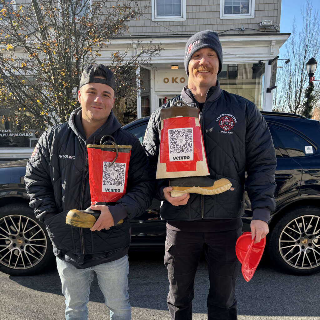 (PHOTO: Rye PD Local 2029 raised $8,472 during the union's annual boot drive on Saturday, December 7, 2024. Fire Fighters Brandon Antolino and Kevin Ramsey on Purchase Street. Contributed: Local 2029.)