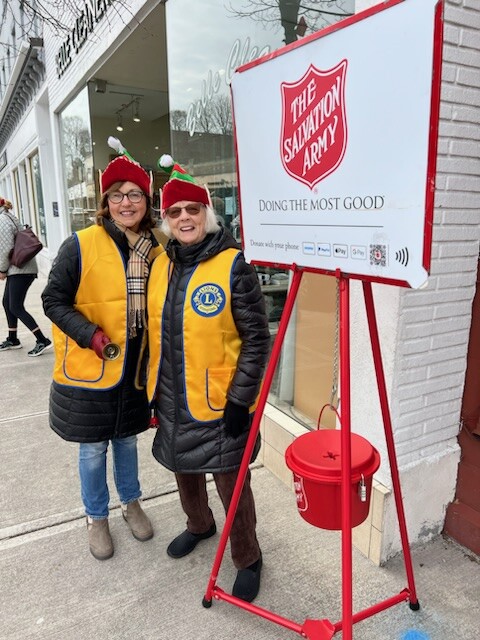 (PHOTO: Rye City Lions Co-President Ann Higgins and Barbara Brunner ringing the bell in downtown Rye for the Salvation Army. Contributed.)