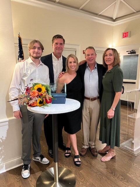 (PHOTO: Kelly Janscki with her family. Janscki was the 2024 recipient of the Rye City Lions' James A. and Marion M. Shea Community Service Award. A celebration dinner held at Whitby Castle in November. Contributed.)