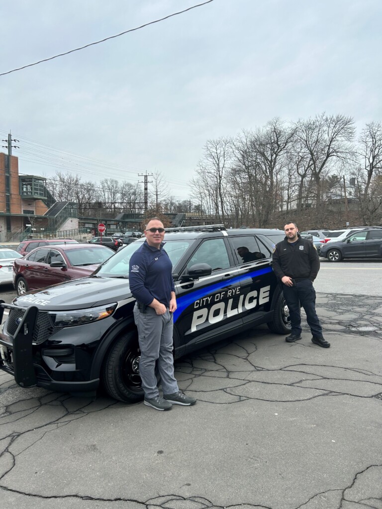 (PHOTO: Rye PD Detective and Rye PBA President Gabe Caputo with Officer James Foti outside Rye PD headquarters. Contributed.)