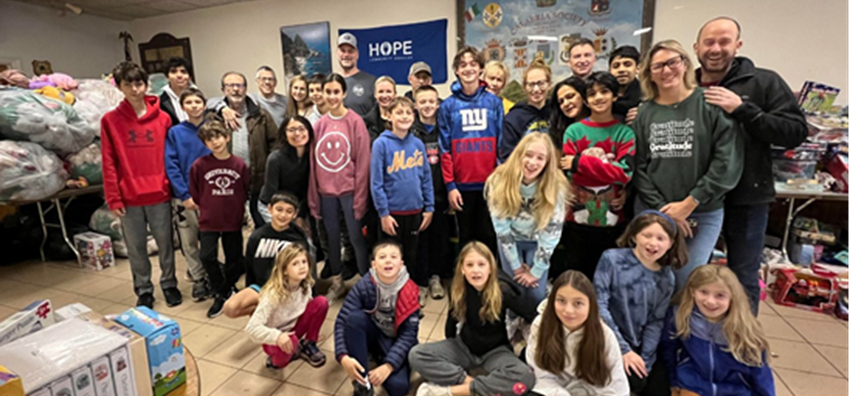 (PHOTO: Rye volunteers sorting holiday gifts at HOPE Community Services. Contributed.)