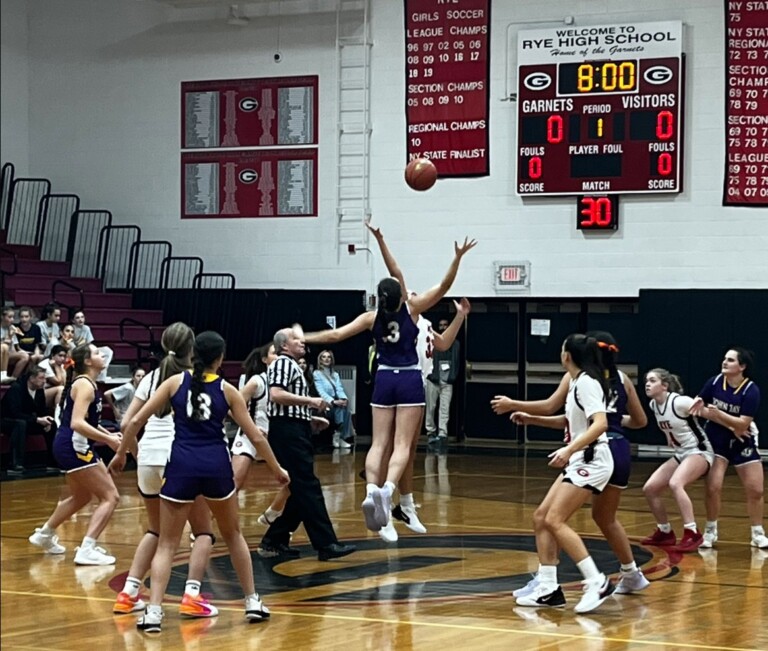 (PHOTO: The 2024-25 Rye Girls Varsity Basketball Team tipped off with JJCR in their season opener on December 6.)