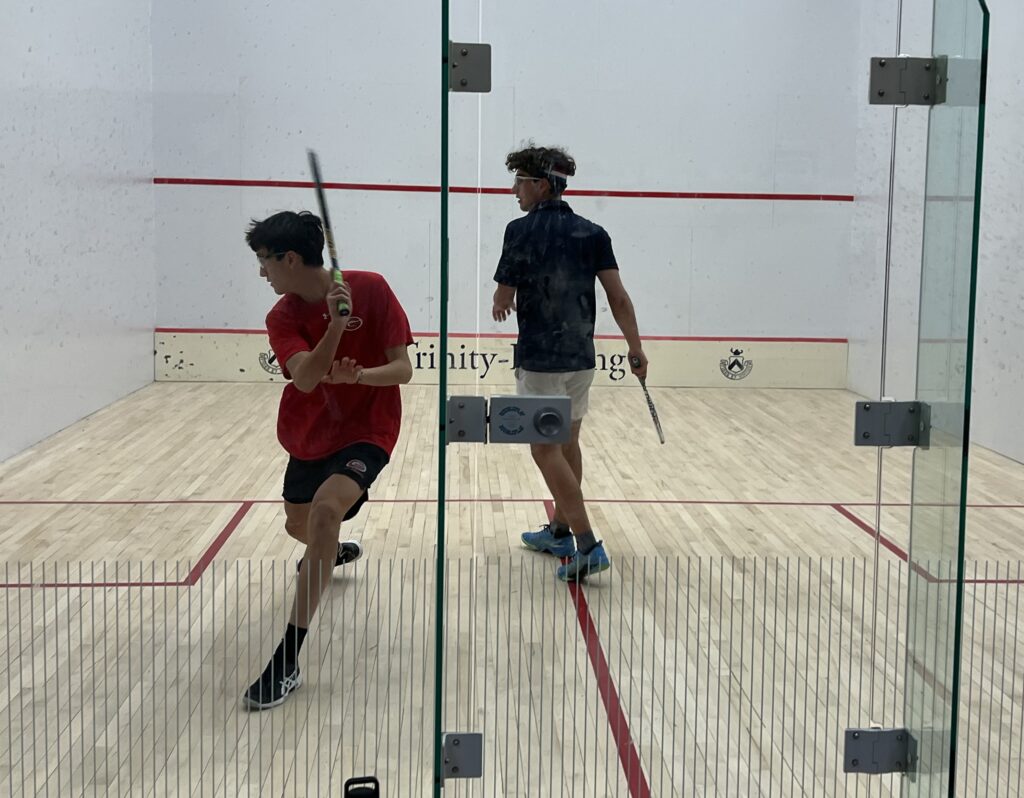 (PHOTO: Senior and Rye Varsity Squash Captain Andrew Chun playing at Trinity Pawling School on Thursday, January 16, 2025. Contributed.)