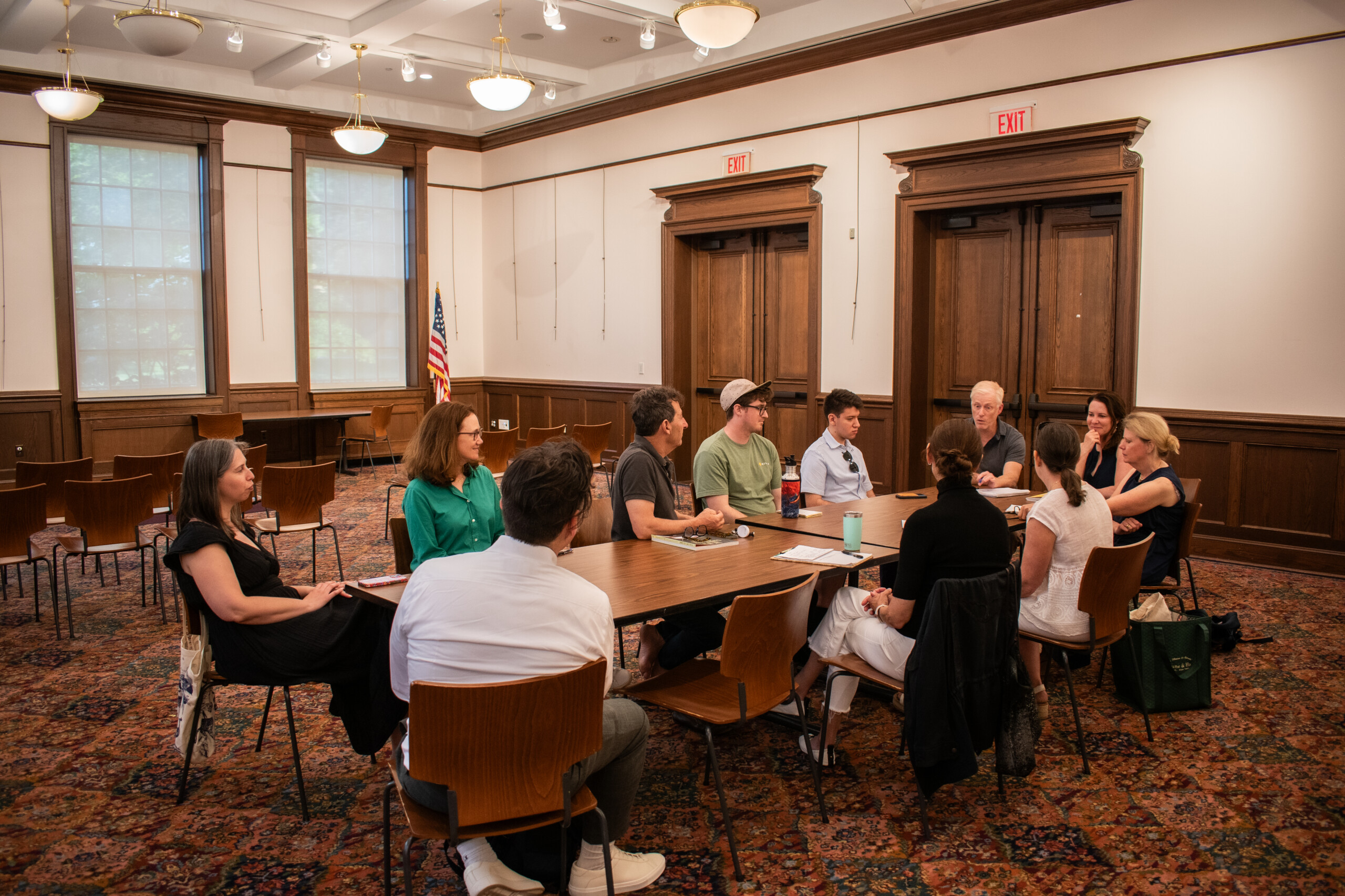 (PHOTO: The Rye Sustainability Committee meeting at the Rye Free Reading Room on June 18, 2024. At the far end, closest to the door if former chair James Ward, then to his right (moving counterclockwise in the photo: Florian Soezer (student representative), Drew Tschetter (guest), Chris Cohan (RSC member), Hilary Garland (then RSC member, now chair), Leah Eden (guest), Jeffery Prosserman (RSC member), Gretchen Kaye-Crowley (RSC member), Linda MacKay (RSC member), Tracy Stora (guest) and Donna Providenti (vice chair, RSC). Credit: Tilman Oberbannscheidt.)