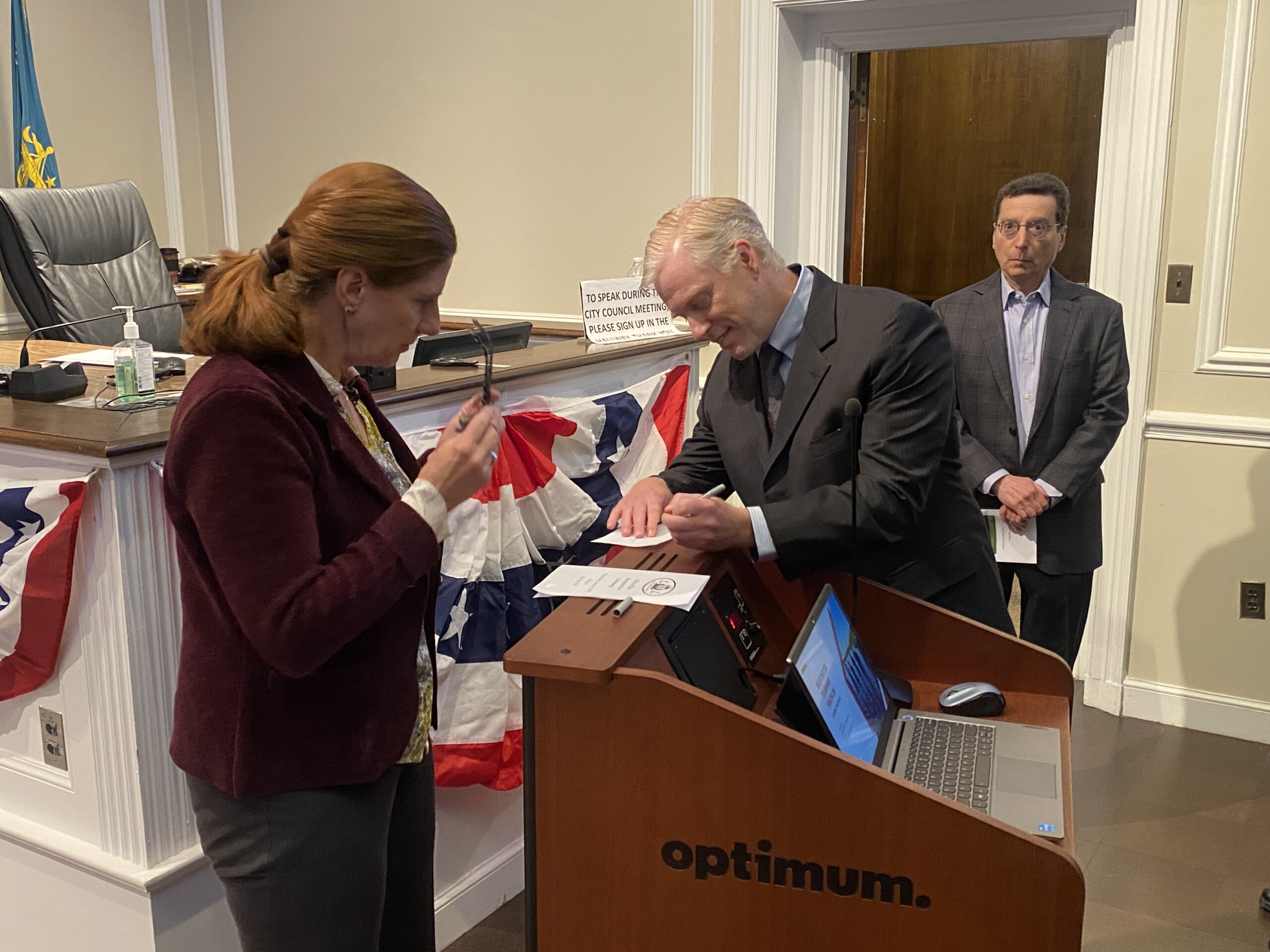 (PHOTO: James Ward was sworn in as the City of Rye's newest City Council member on Wednesday, January 8, 2025. Judge Valerie Livingston looked onas Ward completed the paperwork to make it official. Rye Mayor Josh Cohn looked on.)