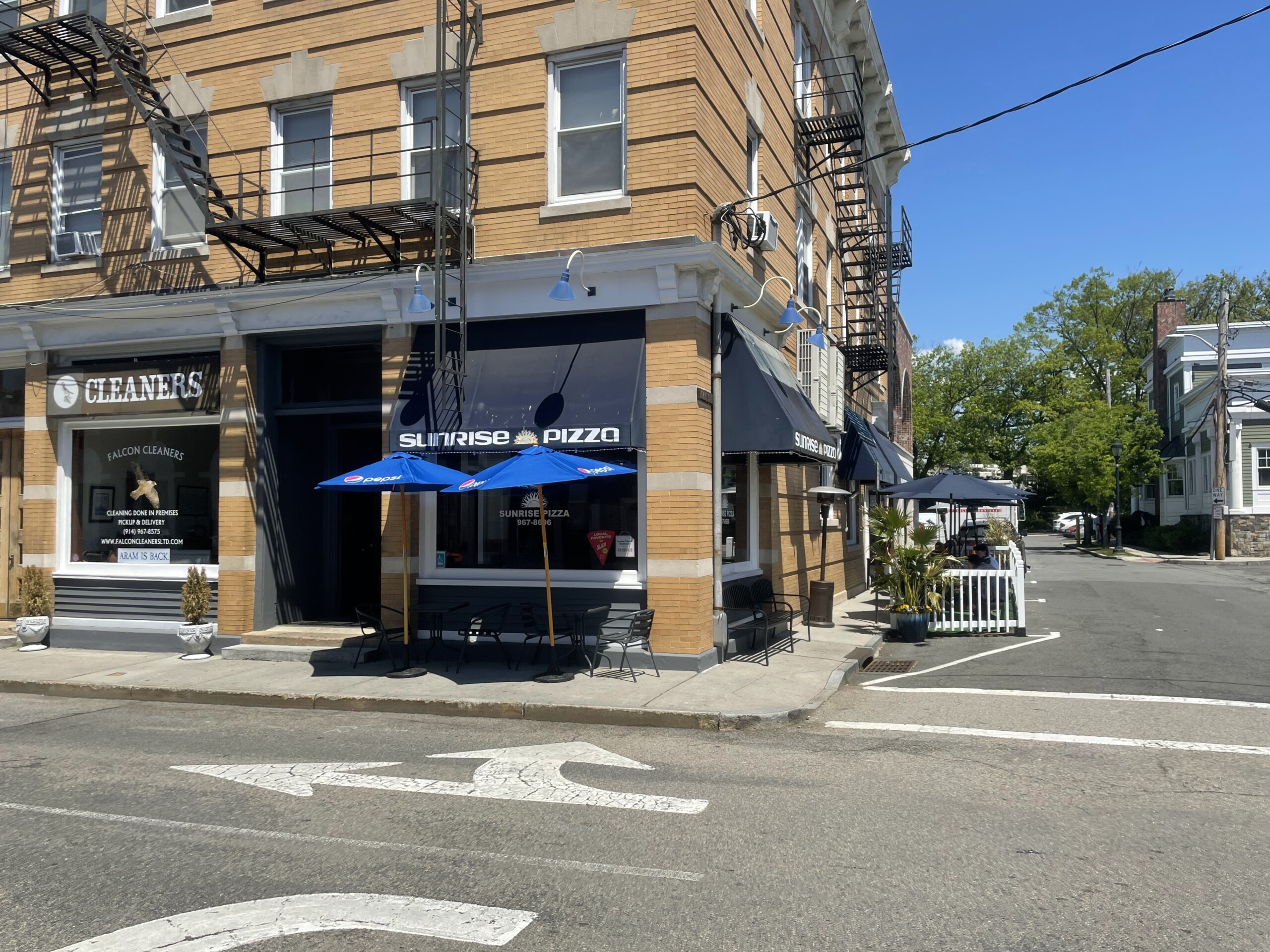 (PHOTO: Sunrise Pizza on 7 Purdy Street. 88 Purchase is the adjacent building to the left. File photo. Credit: Matt Capaldi.)