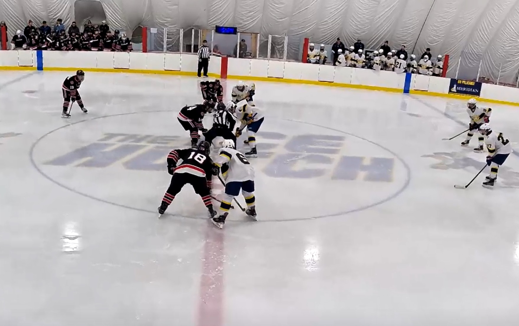 (PHOTO: Rye Hockey lining up for the opening faceoff against Pelham on Tuesday, January 14.)