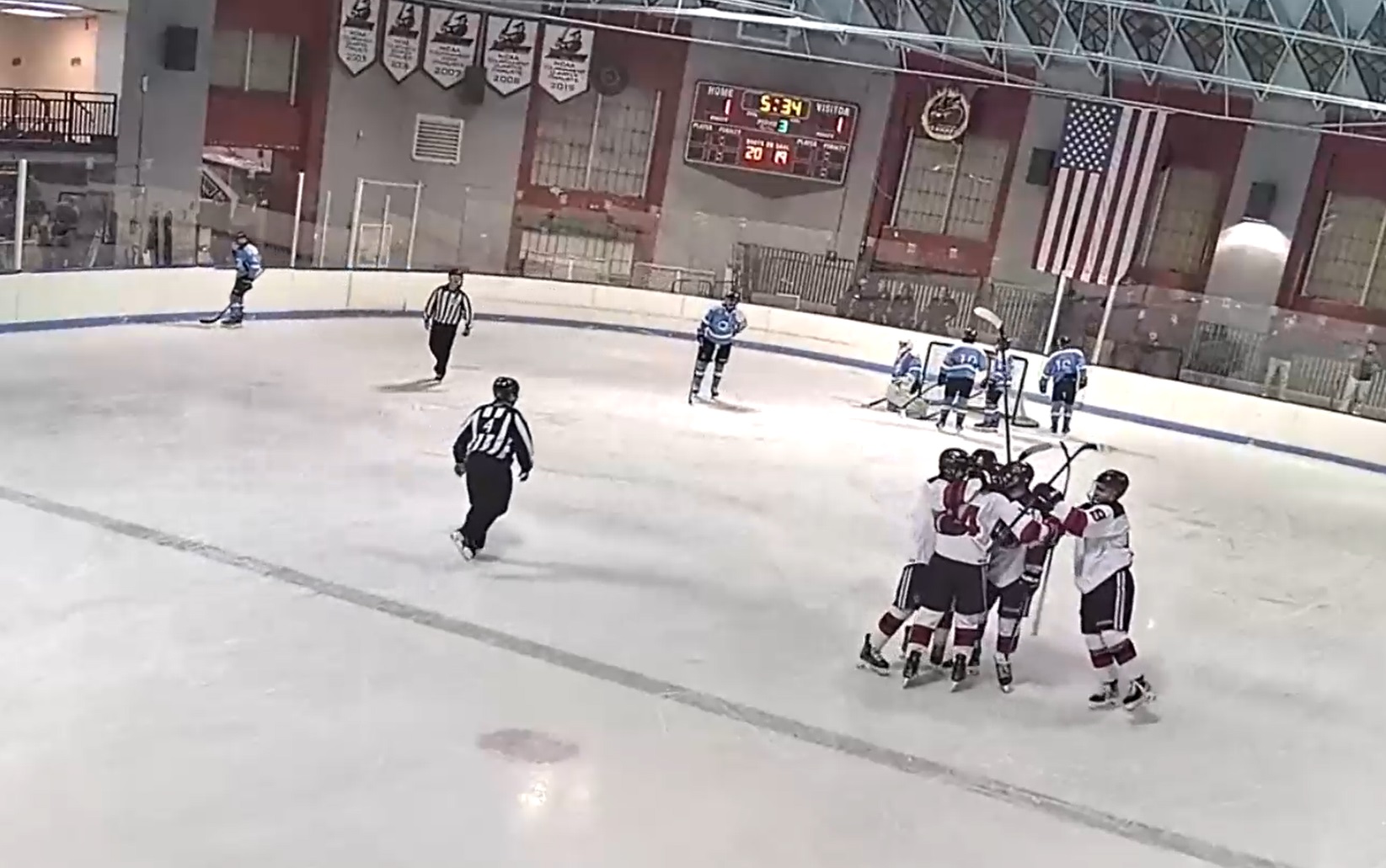 (PHOTO: Rye Varsity Hockey celebrates Tyler McDermott's go-ahead goal in their 2-1 victory over Suffern.)