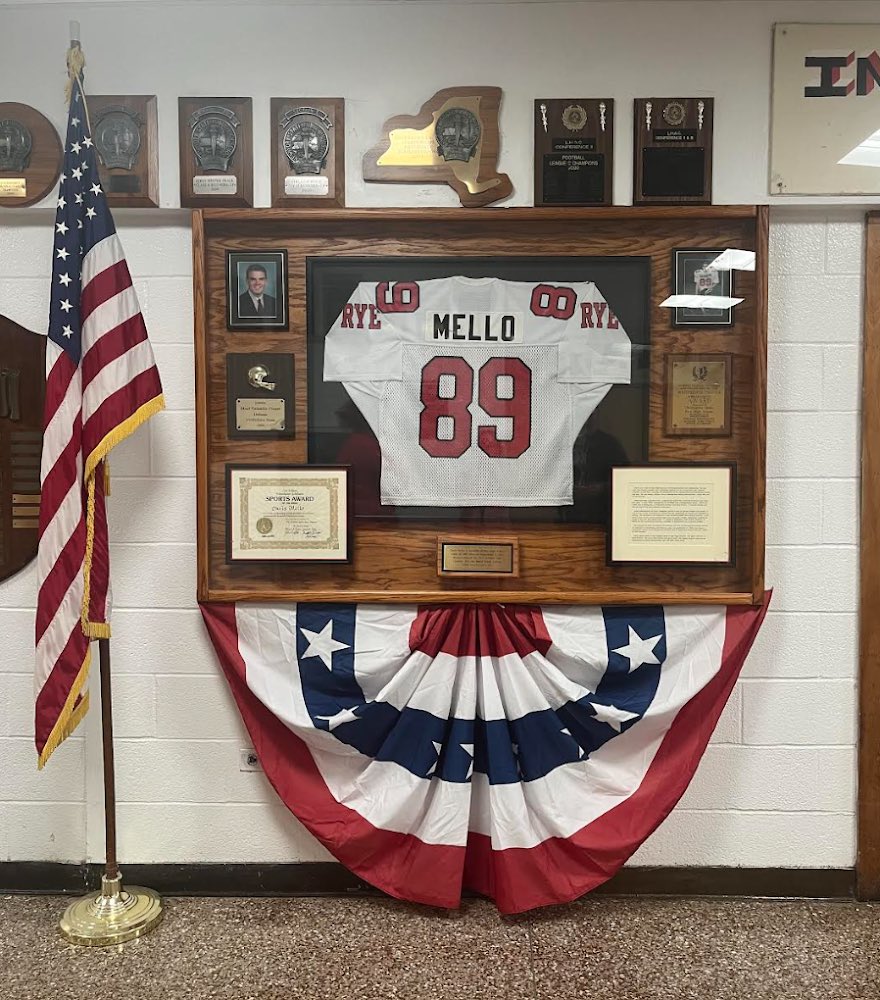 (PHOTO: A display at Rye High School honors Doug Mello's son Chris (RHS '94) who was lost in the 9/11 attacks.)