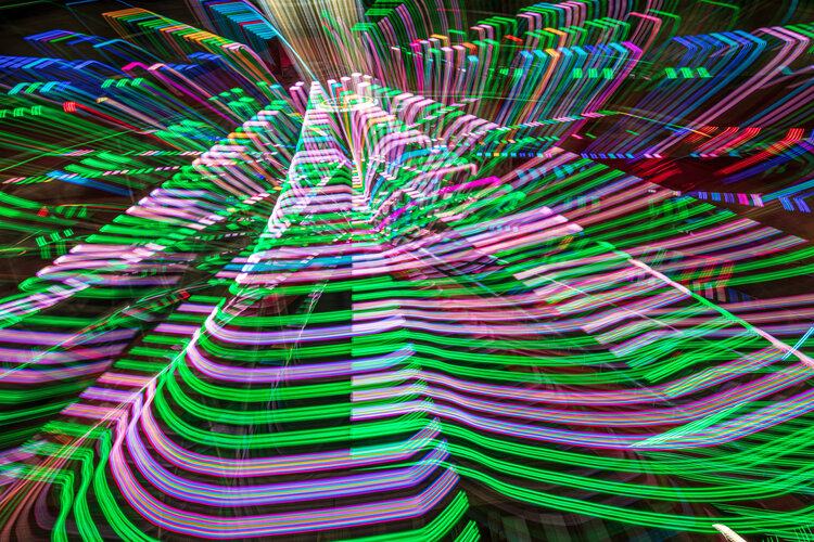 (PHOTO: The many lights and colors of Playland. In addition to the attractions at the amusement park, Playland's waterfront location offers views of the Long Island Sound. By JoAnn Cancro.)