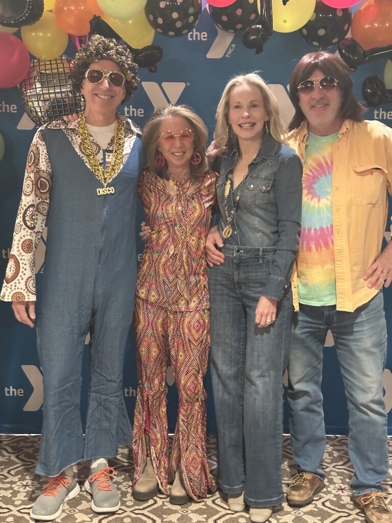 (PHOTO: At the Rye YMCA’s Dancing Through the Decades fundraiser on Friday, February 28, 2025 John and Cynthia Weber and Sara and Taegan Goddard. Contributed.)