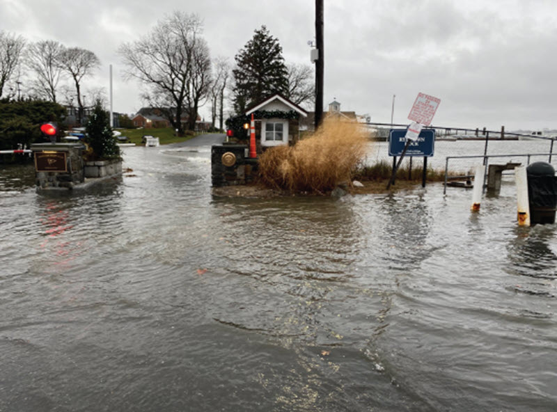 (PHOTO: Flooding at the entrance to American Yacht Club on Milton Point. On the Planning Commision April 8. 2025 agenda: American Yacht Club, Permit: Wetlands (WP#564) / Site Plan (SP#413), Planned site and architectural improvements to both the clubhouse and beach house facilities. Source: planning documents.)