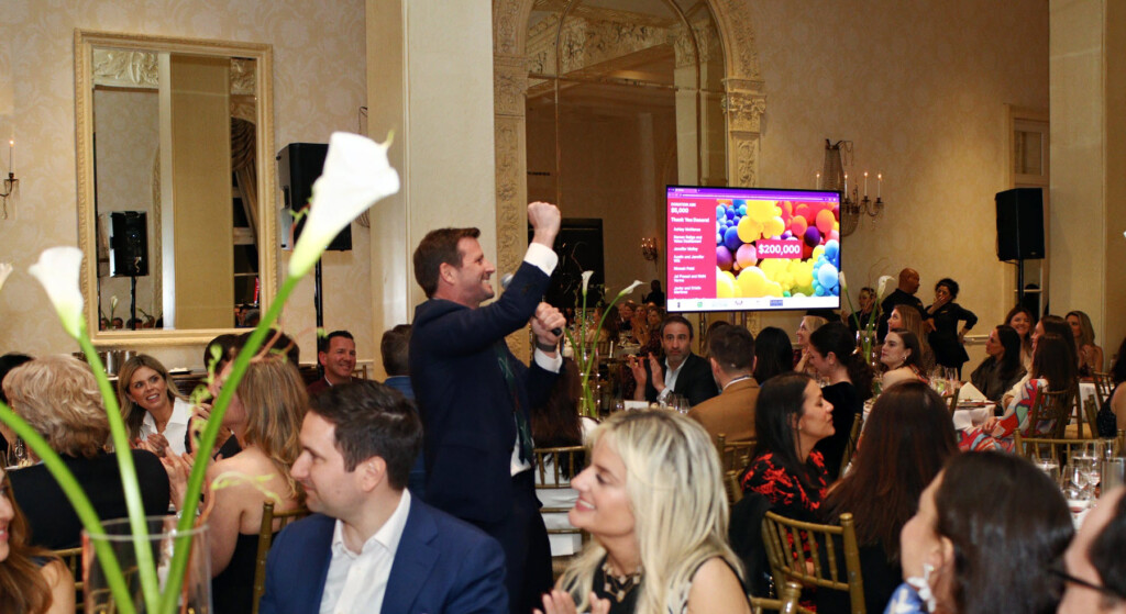(PHOTO: Rye Fund for Education's annual gala on April 3, 2025 raised over $530,000. Auctioneer Jamie McDonald working the crowd. Contributed.) 