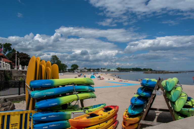 (PHOTO: The kayak concession on Oakland Beach at Rye Town Park. Summer, 2024. Credit: Tilman Oberbannscheidt.)