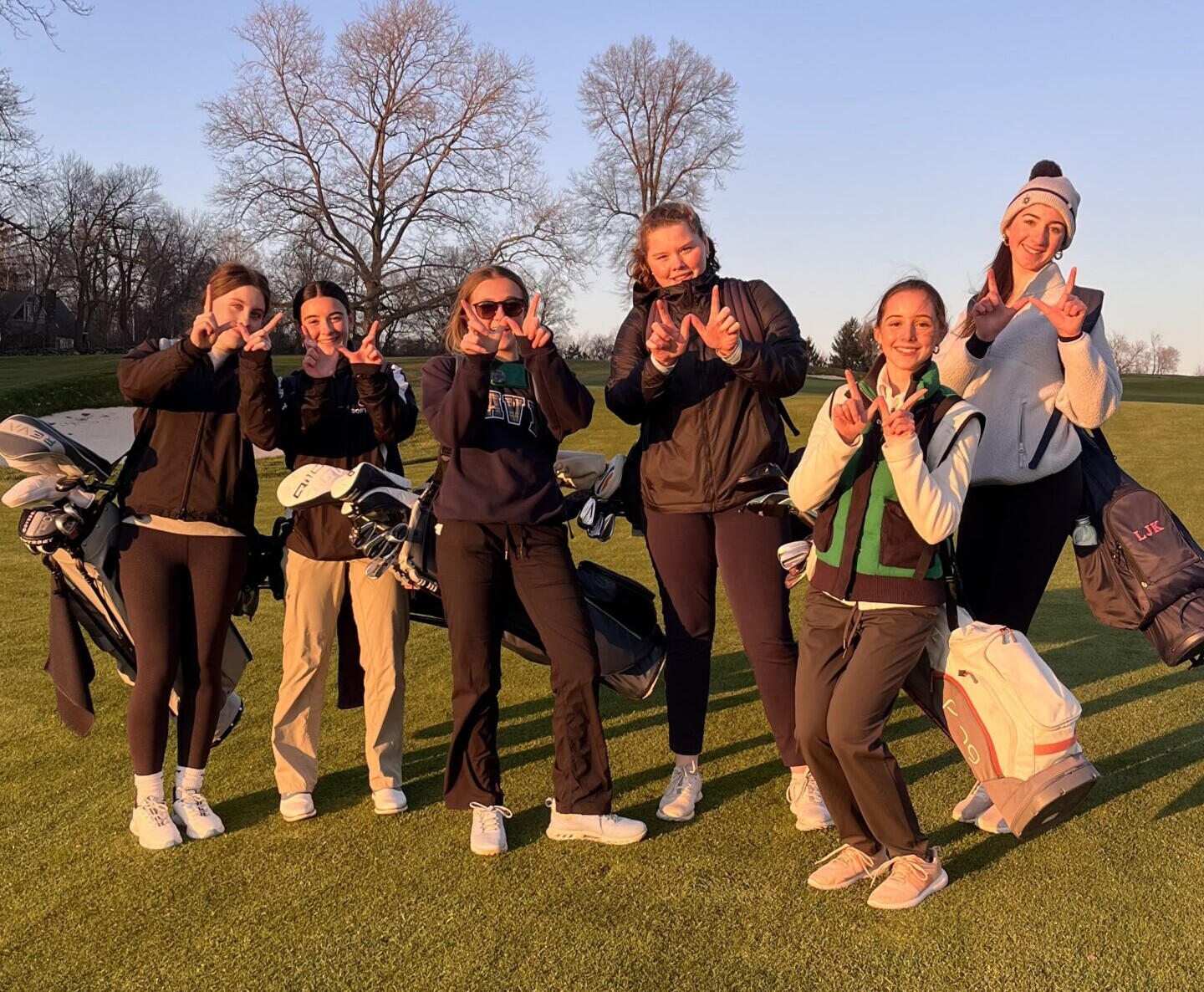 (PHOTO: Rye Girls Golf throws up Ws after defeating Edgemont by one stroke on Wednesday, April 9. Contributed.)
