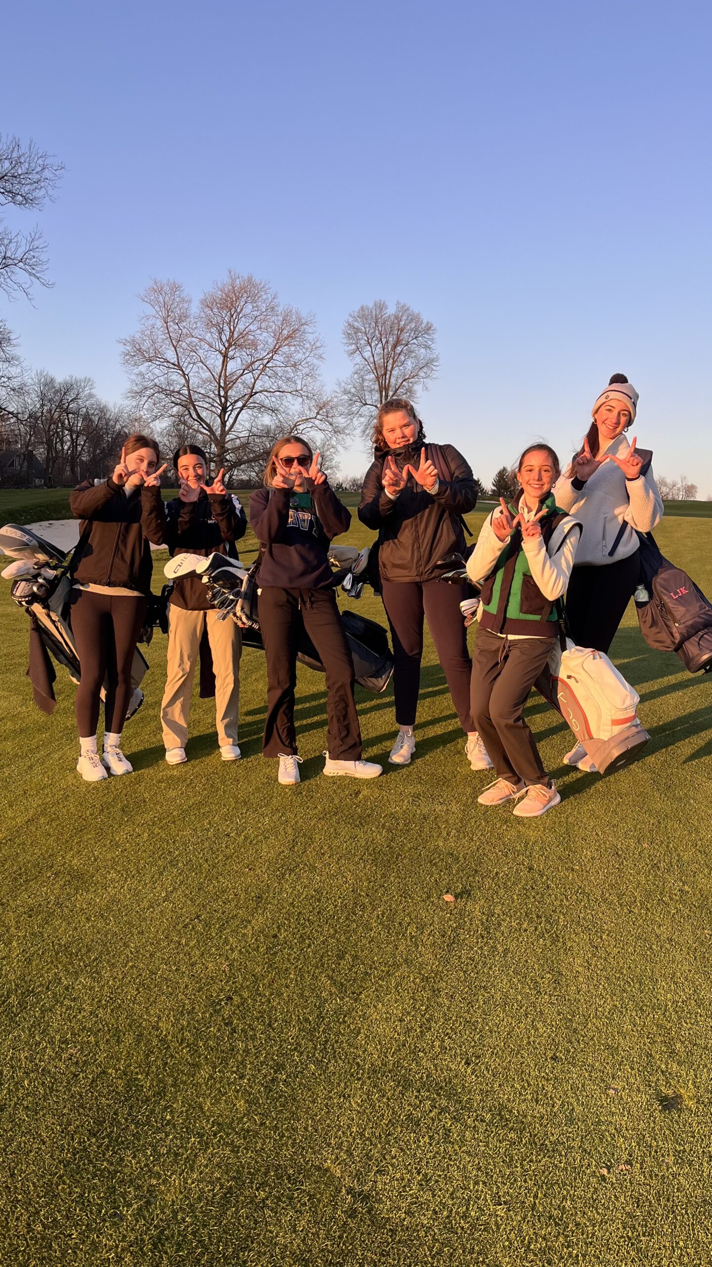 (PHOTO: Rye Girls Golf throws up Ws after defeating Edgemont by one stroke on Wednesday, April 9. Contributed.)