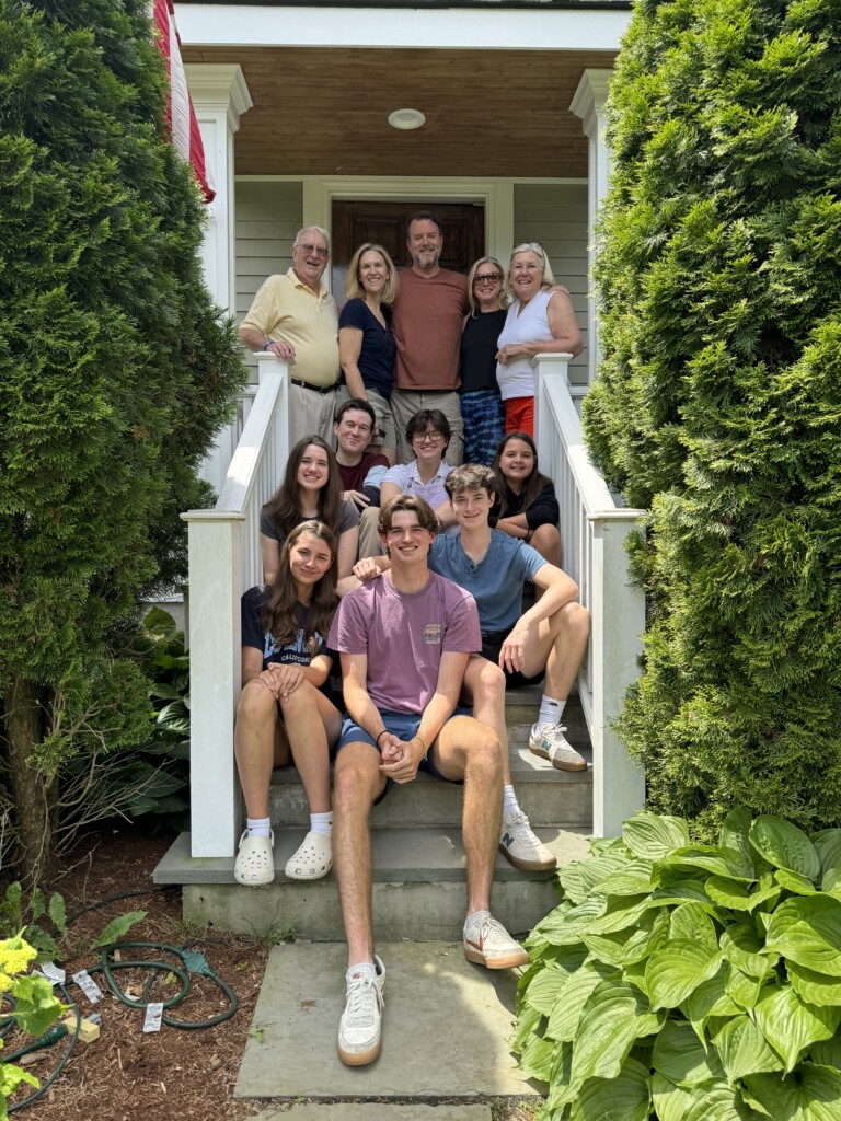 (PHOTO: Rye Lifer Kendra Moran and her family on the steps of her parent's home on Osborn Road in June 2024, the day before they moved. Contributed.)