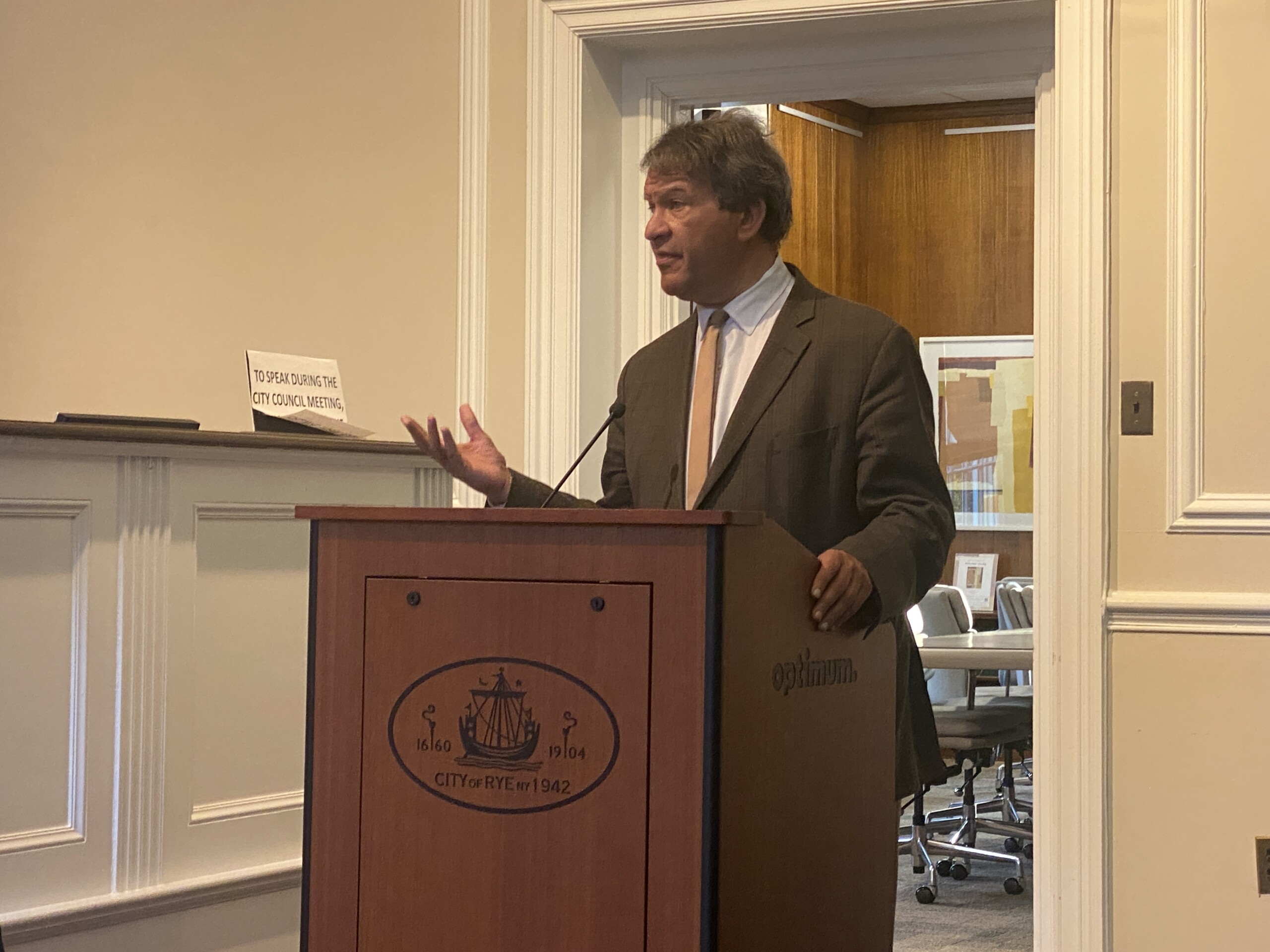 (PHOTO: NY-16 Congressman George Latimer at the Rye City Council on April 23, 2025 where he warned the City to expect federal cuts to "trickle down" and impact Rye and other surrounding communities.)