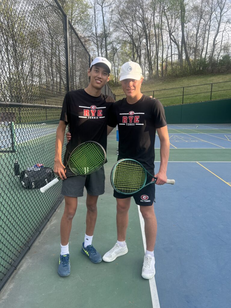 (PHOTO: Rye Boys Tennis' top doubles team of Lou Kim-Reuter (left) and Filip Glitterstam (right) after a win on Thursday, April 24. Contributed.)