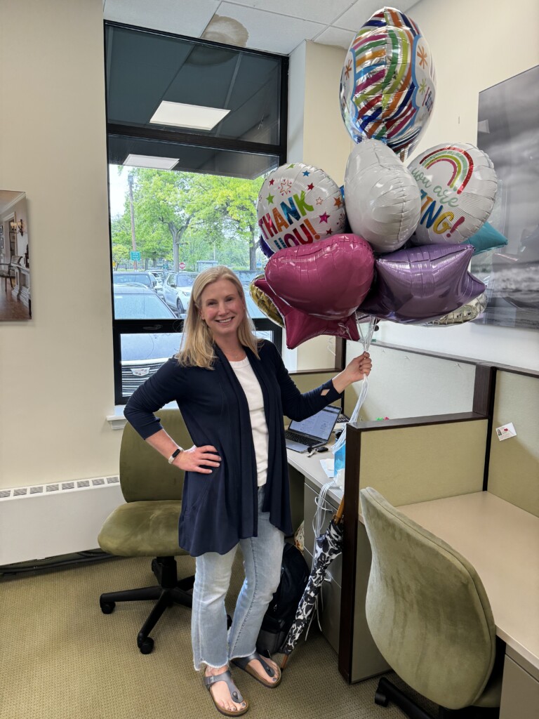 (PHOTO: Rye Lifer Kendra Moran in her office at Houlihan Lawrence in Rye. Contributed.)