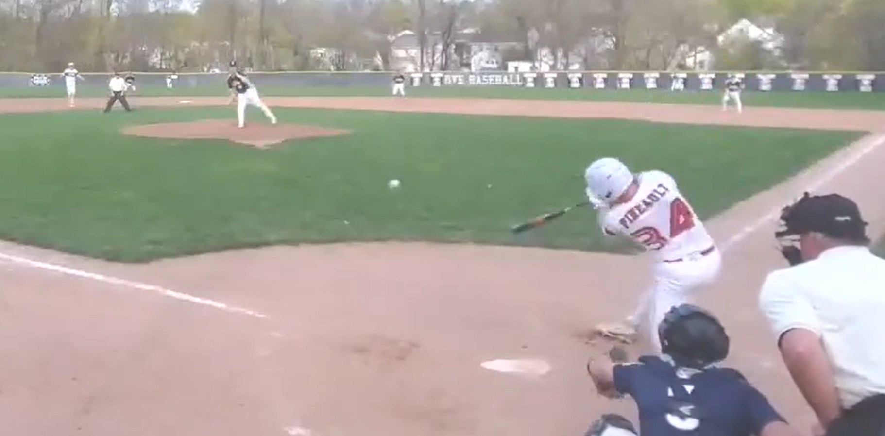 (PHOTO: Rye Baseball's Jackson Pineault hitting an RBI single against Pelham on Thursday, April 24. Credit: GameChanger.)