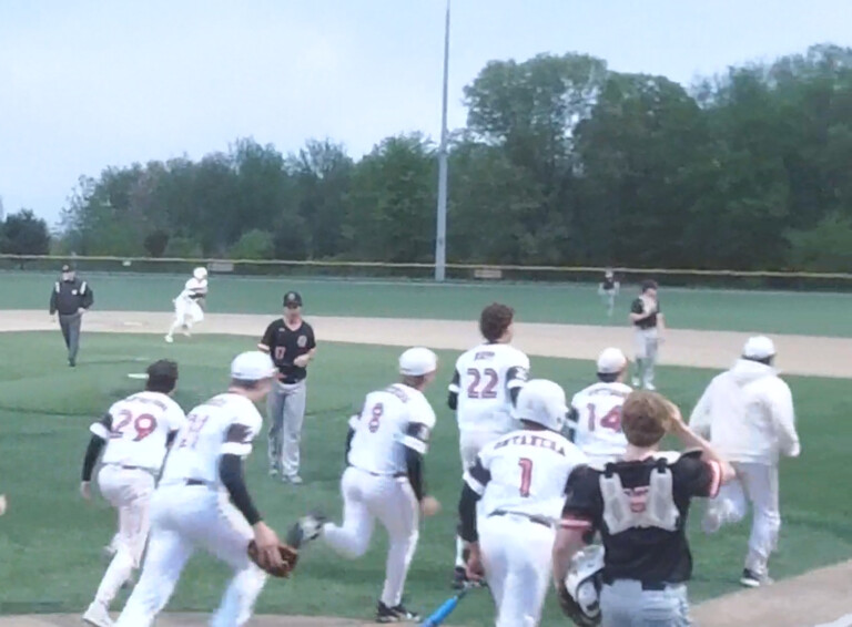 (PHOTO: Rye Baseball rushes out of their dugout to surround Lucas London after his walkoff single against Croton-Harmon on Tuesday, May 6. Credit: Game Changer.)