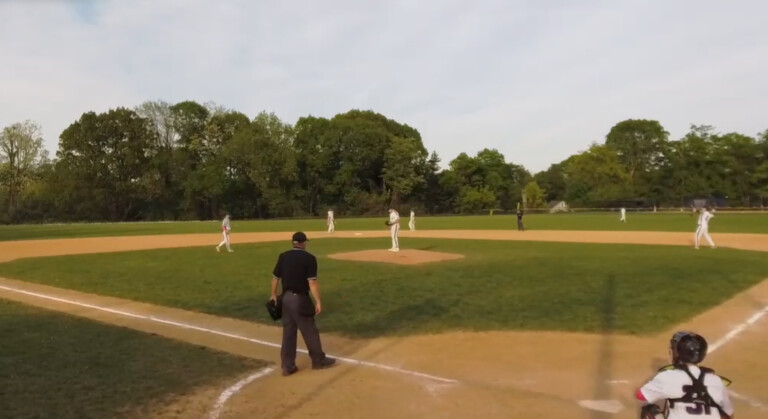 (PHOTO: The Eastchester Eagles warm up in the seventh inning against the Rye Garnets Baseball Team on Monday, May 12. Credit: Game Changer.)