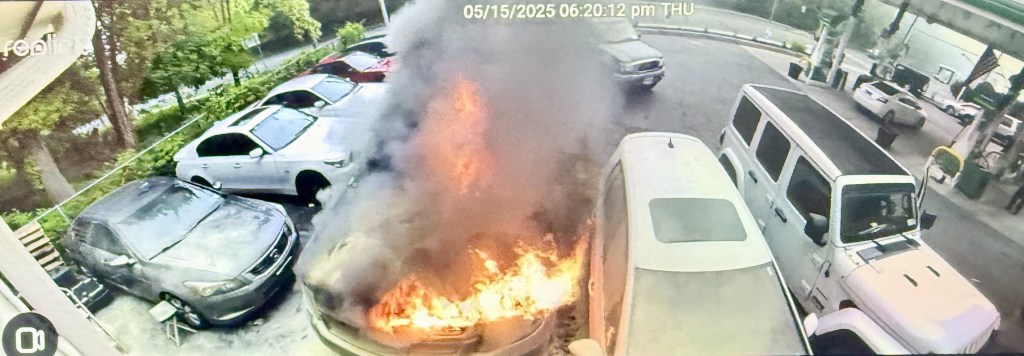 (PHOTO: Security camera (PHOTO: Security camera footage shows the Chevrolet SUV car fire at the BP gas station on the Boston Post Road on Thursday evening, May 15, 2025. Contributed.)