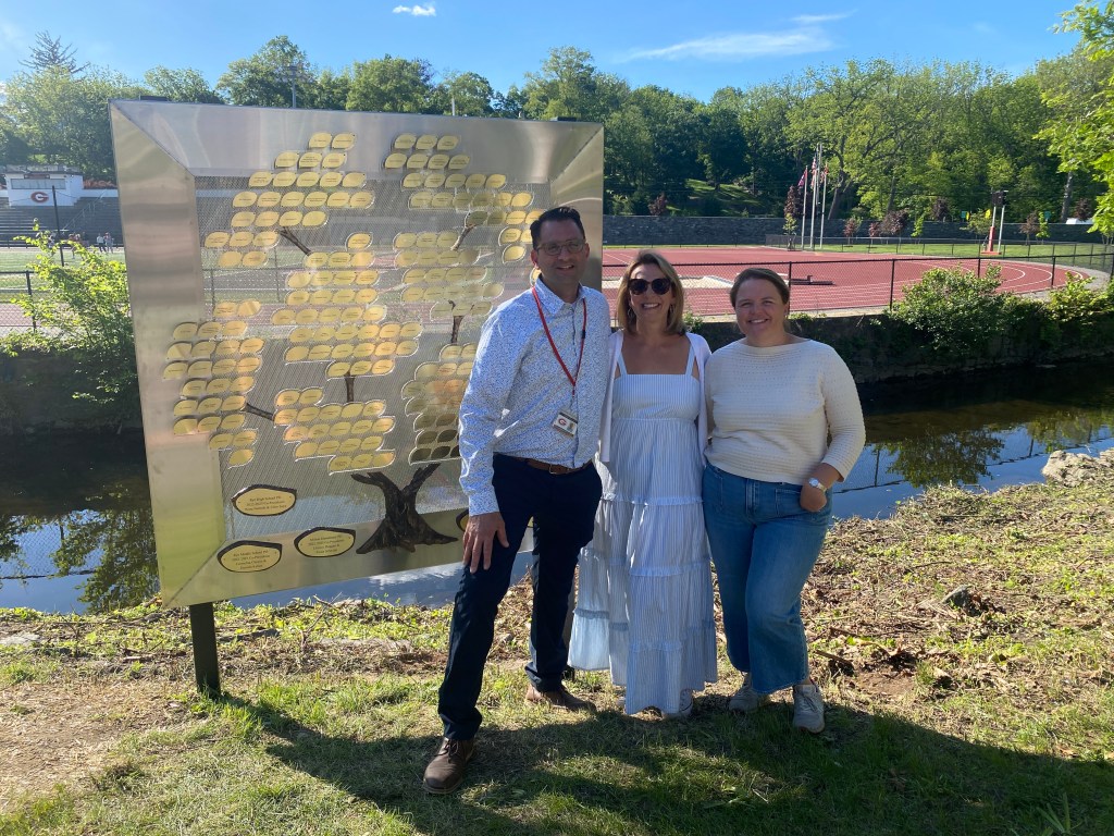 (PHOTO: Rob Gimigliano, Jen Crozier and Lucy Berkoff of the Spring for Rye team at the dedication on May 20, 2025. Two hundred native trees were planted across all four school campuses in Rye.)