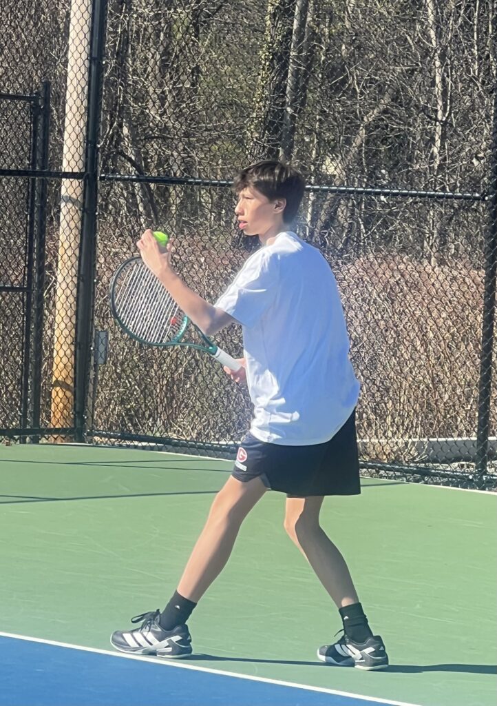 (PHOTO: Rye Boys Tennis' Xavier Morell playing second singles for first time in his varsity career on Thursday, May 1. Contributed.)