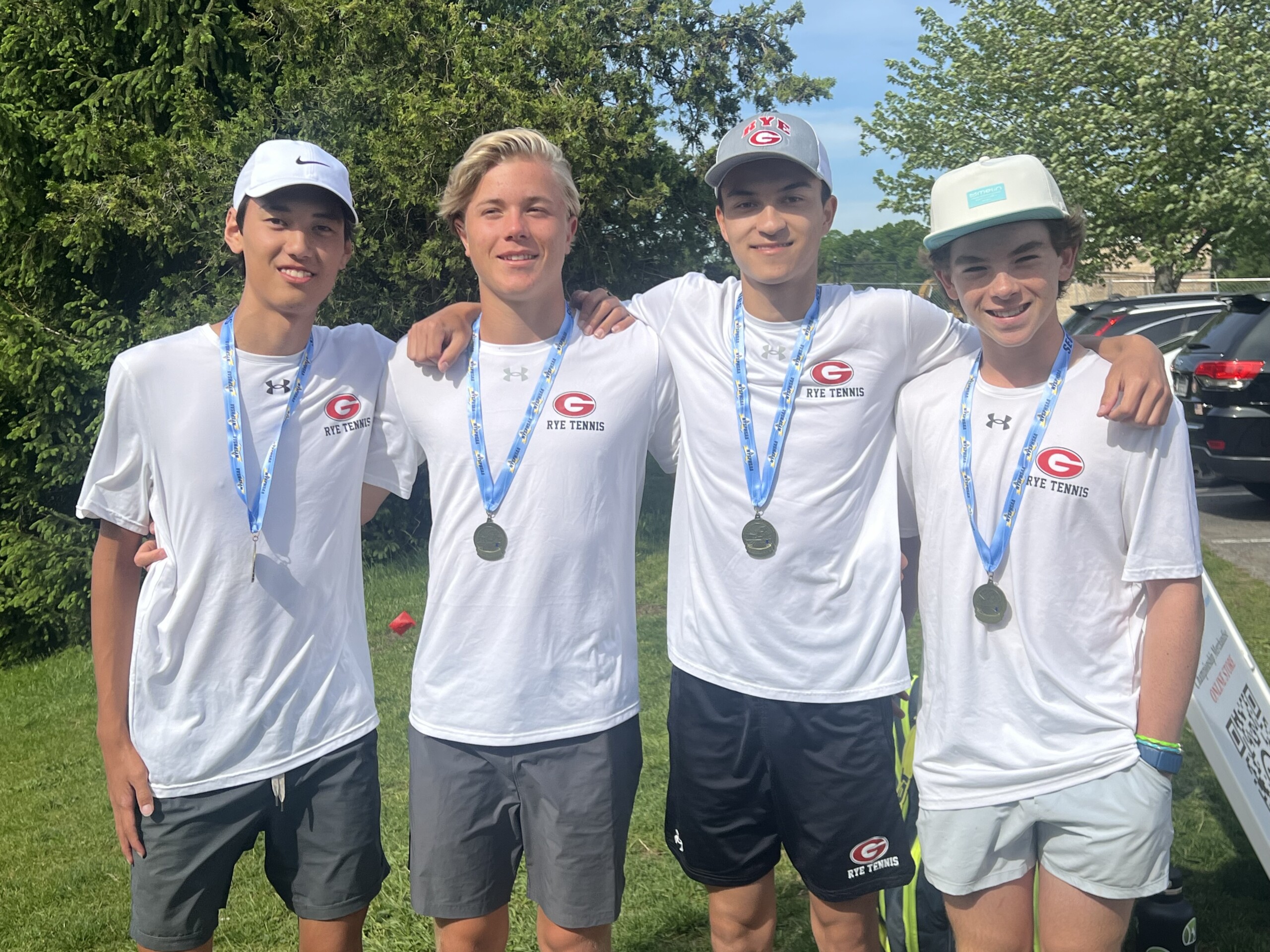 (PHOTO: Rye Boys Tennis' four best doubles players. L to R: Lou Kim-Reuter, Filip Glitterstam, Alex Gordon, Grant Lobo. Contributed.)