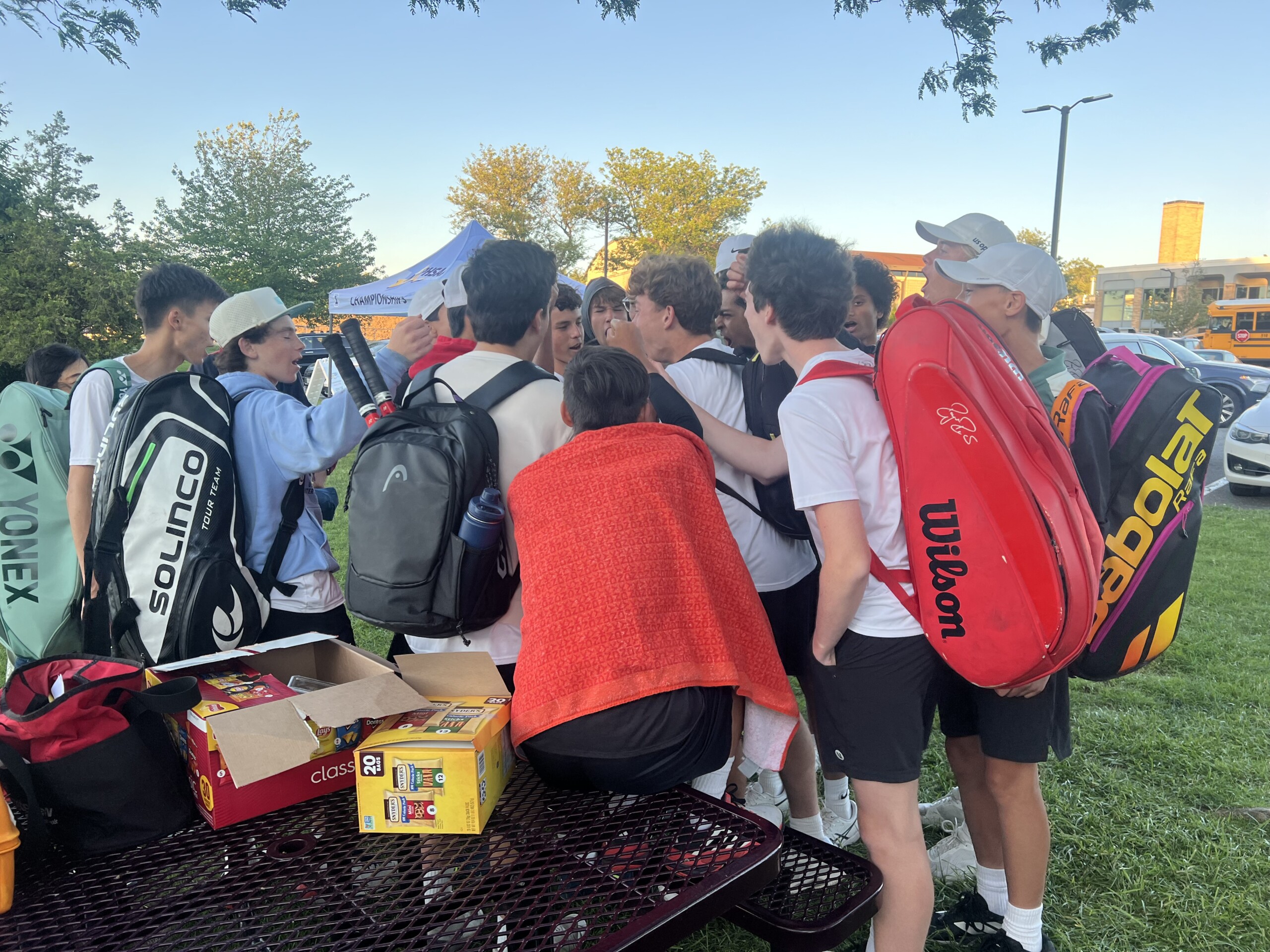 (PHOTO: The 2025 rye Boys Tennis Team huddling at the Section 1 semifinals on Monday, May 19. Contributed.)