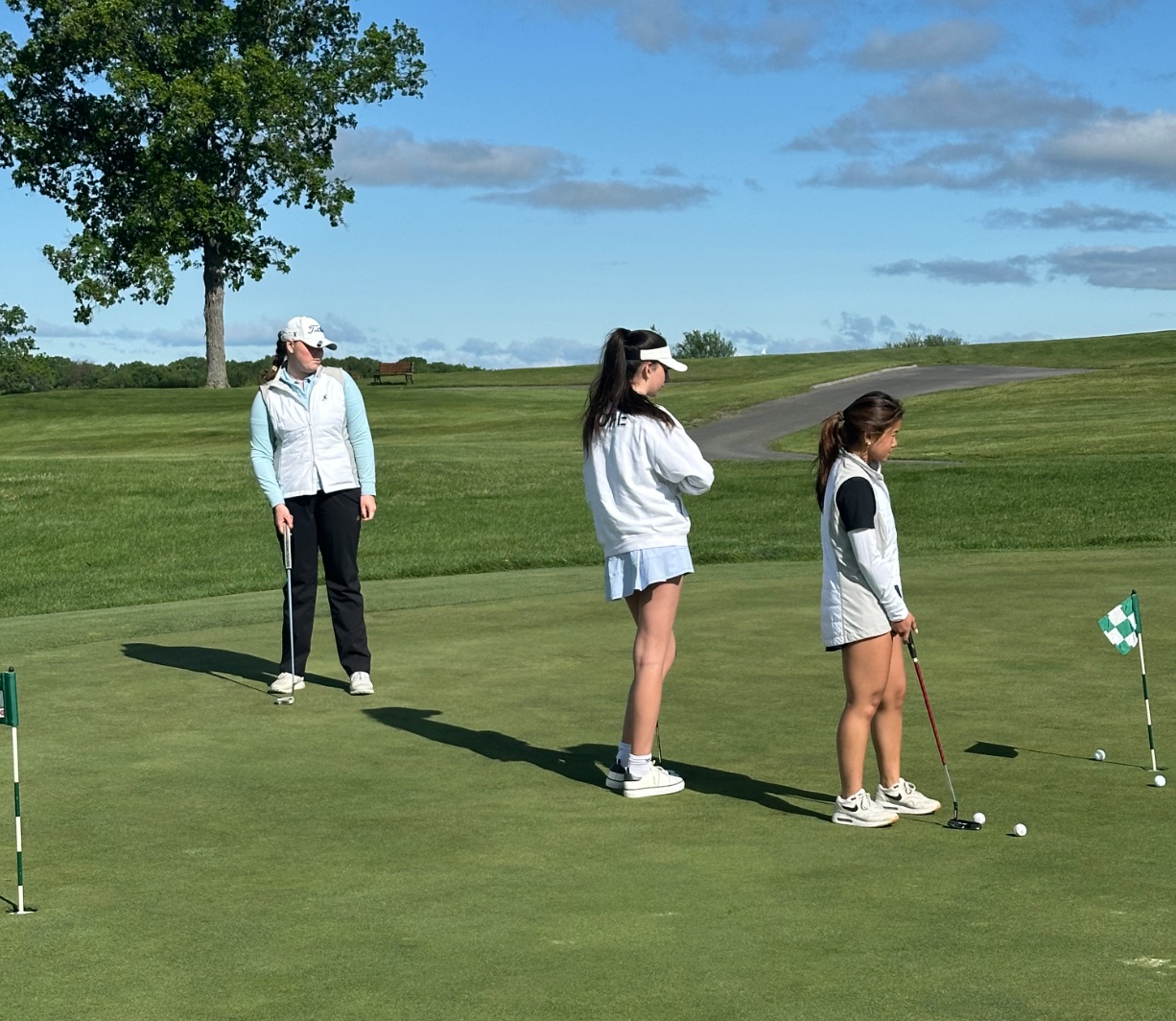 (PHOTO: Myla Bisceglia, Leila Kubursi, and Phoebe Lee on the practice green before their big 2nd place finish. Contributed.)